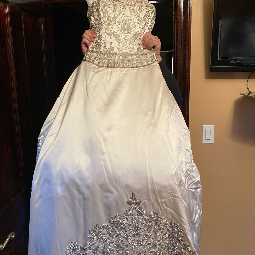Never worn and brand new designer Kenneth Pool Wedding dress